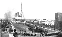 Passenger liner SS Royal Edward pulled by a tug