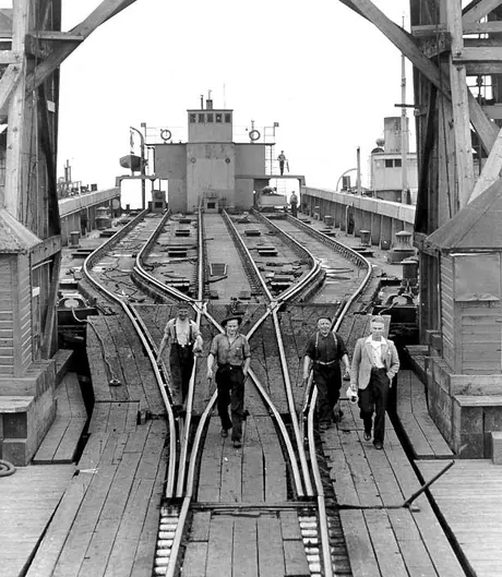 CN freight car barge No. 109 and tugboat No. 1 seen through a CN barge and ferry slip