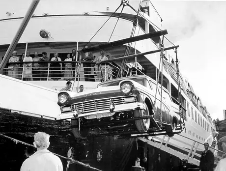Unloading a Ford station wagon from passenger ship CNSS Prince George