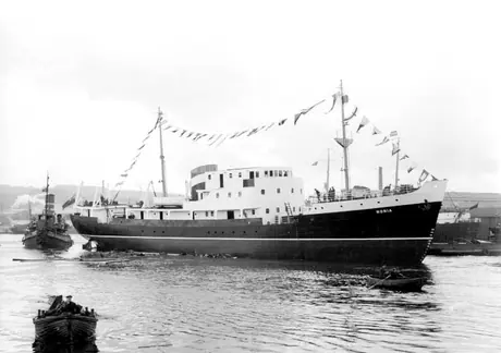 Launching of the Newfoundland coastal ship MV Nonia with tug Danny in the background