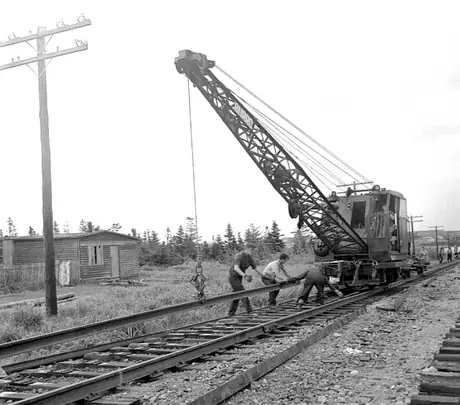 A track-laying machine laying track for the Nfld. Ry.