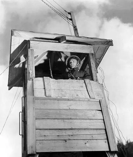 A military guard in a sentry tower at the Prince Rupert shipyard and dry dock