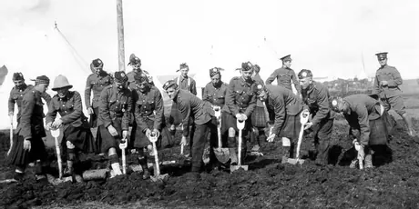 Soldiers digging at a WWI training camp