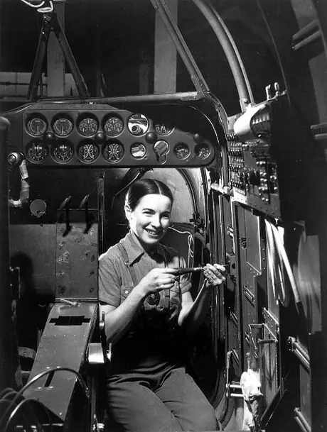 A woman working in the cockpit area of a Bristol Bolingbroke at a Fairchild Aircraft factory