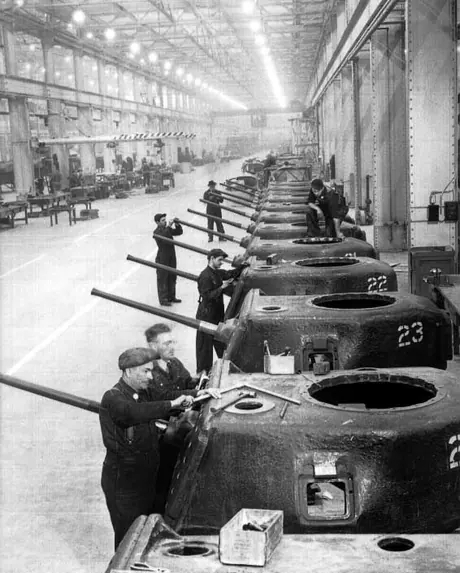 Fitting the guns on a 28-ton tank at Montreal Locomotive Works