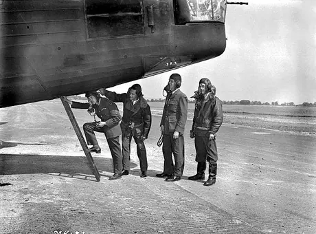 An RCAF bomber crew climb into their Wellington bomber just before an air raid