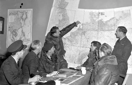 Pointing out some of the German targets he and his crew bombed