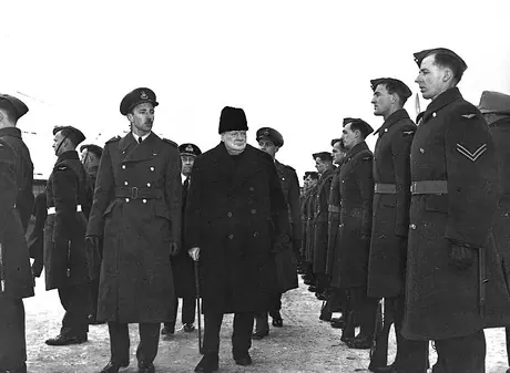 Great Britain's PM Sir Winston Churchill inspects an RCAF guard during his visit