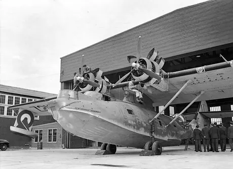 RCAF mechanics look over a Consolidated Canso PBY outside its hangar