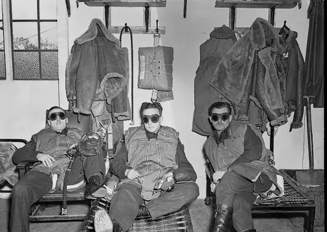 RCAF night fighter pilots wait in their dispersal huts wearing goggles to adjust their eyes to dark