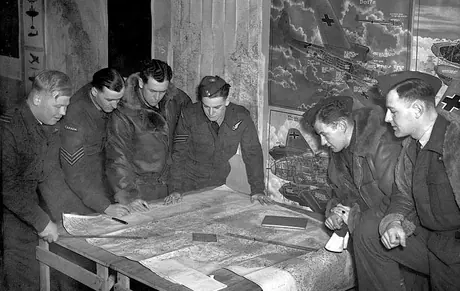 The Wing Commander , C.O. of a Canadian Intruder Squadron giving a lesson in cartography