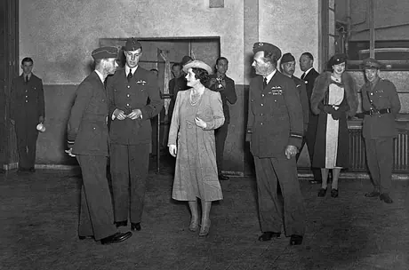 King George VI and Queen Elizabeth inspect the airmen's mess during afternoon tea