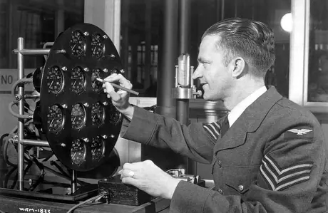 A Royal Canadian Air Force Inspector checks an aircraft panel