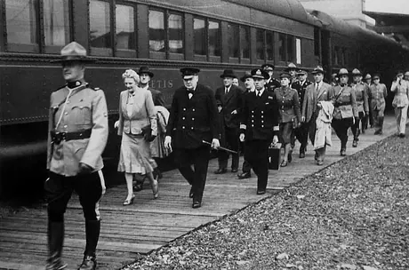Churchill is escorted by mounted police on a visit to Canada