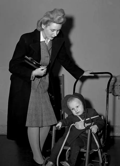 A war bride watches over her toddler at Central Station