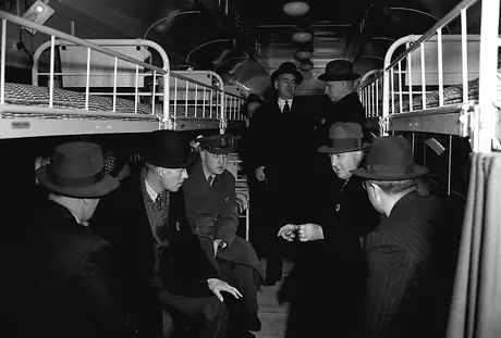 An inspection group examines a new hospital car still in the shop