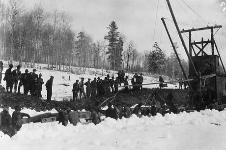A track-laying machine approaches the centre of mile 1372 to complete the Grand Trunk Pacific line