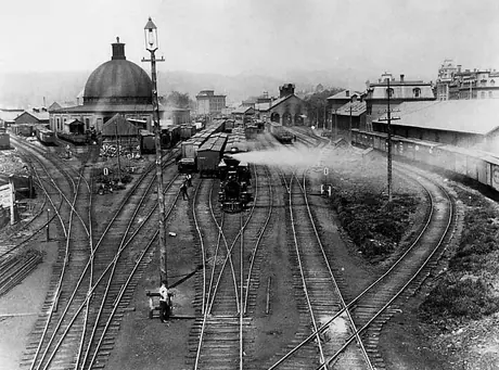 Central Vermont Railways Rutland yard with wood burning steam locomotives and box cars