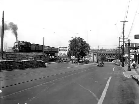 Canadian National Railways Lower Arch Bridge with outbound passenger train headed by steam locomotive 5600
