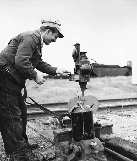 Section man fuels a switch signal lantern