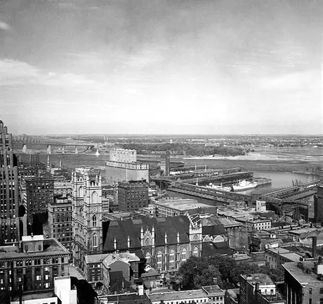 A view of Notre-Dame Basilica and the Montréal Harbour overtop the business district