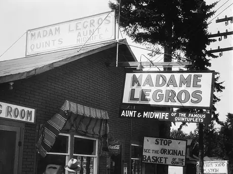 Madam Legros' shop, displaying Dionne Quintuplets memorabilia and their original basket