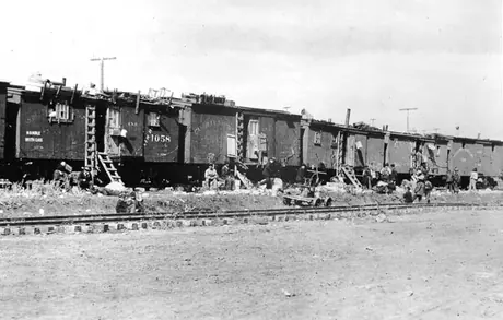 Boarding cars for Canadian Northern Railway construction workers