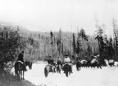 Grand Trunk Pacific Railway survey party on horseback crossing a stream