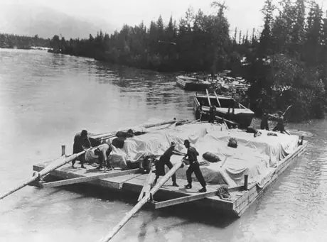Contractors transport supplies to Grand Trunk Pacific Railway Construction site along North Thompson River
