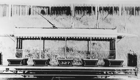 A Toronto Railway Company open air electric streetcar no. 327, side view