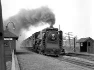 Canadian National Railways steam locomotive no. 5265 and passenger train stop at the Île Perrot train station