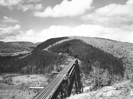 A Canadian National Railways passenger train approaches the Milieu Bridge