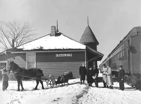 Holiday visitors disembark from the passenger train and prepare for a buggy ride