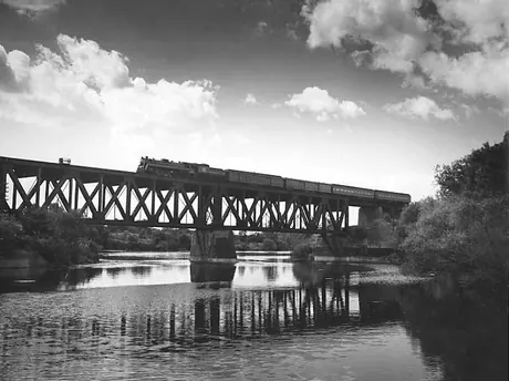 A Canadian National Railways passenger train crosses the Cove Bridge