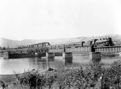 A Canadian National Railways passenger train crosses the Thompson River Bridge