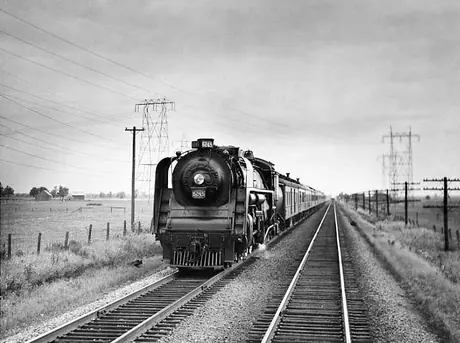 Canadian National Railways steam locomotive no. 6245 hauls passenger train no. 5 along the Montreal to Toronto run