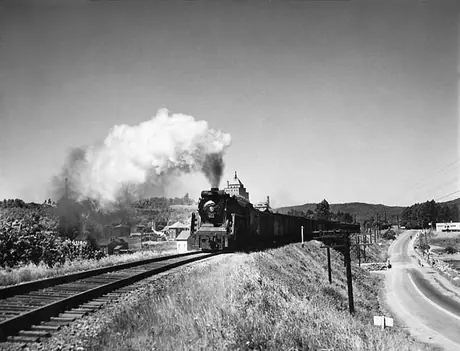 Canadian National Railways steam locomotive no. 6162 hauls an eastbound passenger train extra through the Maritimes