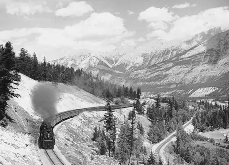 A Canadian National Railways passenger train steams through Jasper National Park