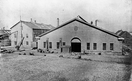 Exterior view of the construction of a railway shop, stores and office building