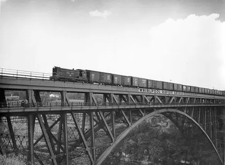 A Canadian National Railways freight train crossing the Whirlpool Rapids Bridge