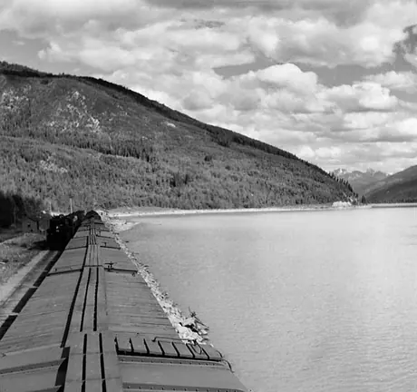 A freight train and a passenger train pass each other near Moose Lake