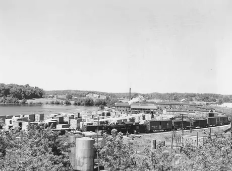 A Canadian National Railway freight train at a wood products mill in Muskoka region