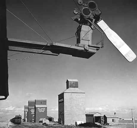 An automatic block signal and a row of grain elevators in Western Canada