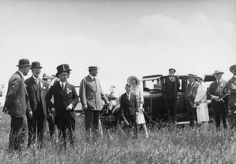 Dignitaries watch a fly past in honour of the Diamond Jubilee of Canada's Confederation