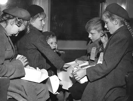 Dutch family of immigrants shares a meal aboard a passenger train