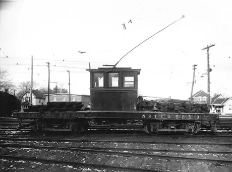 Niagara, St. Catharines and Toronto Railway electric locomotive no. 9 carrying railway ties