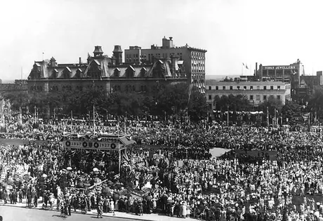 Crowds on Parliament Hill celebrating the Diamond Jubilee of Canadian Confederation
