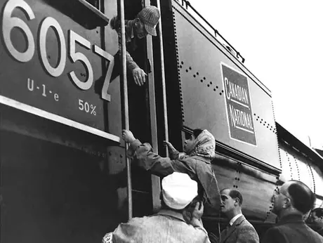 Princess Elizabeth is helped aboard Canadian National Railway steam locomotive no. 6057 during her Royal Tour of Canada