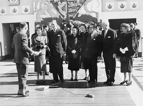 Mayor Arthur Reaune demonstrates an electric toy automobile for Princess Elizabeth and the Duke of Edinburgh during a Royal Visit