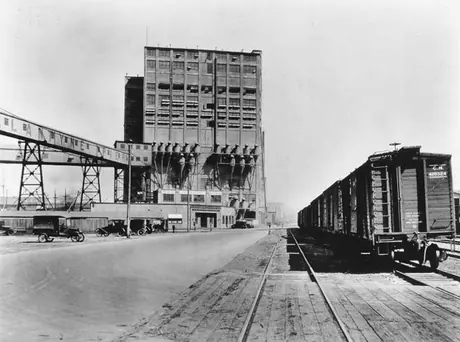 Canadian National Railway freight cars beside the Vancouver Harbour Commission elevator and offices